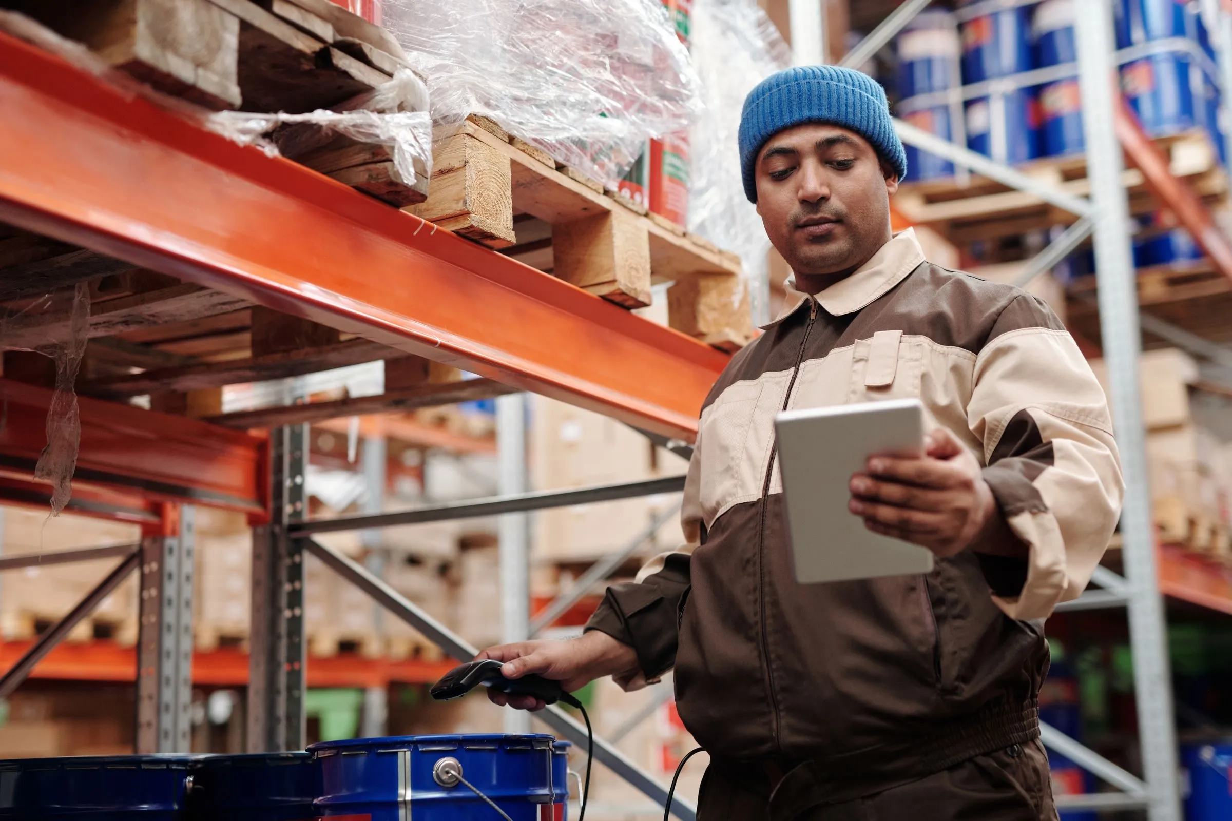Warehouse worker checking stock on a tablet